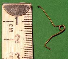 treble spring and tape measure to show size